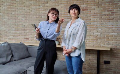 Female real estate agent showing apartment, house, to buyer, tenant